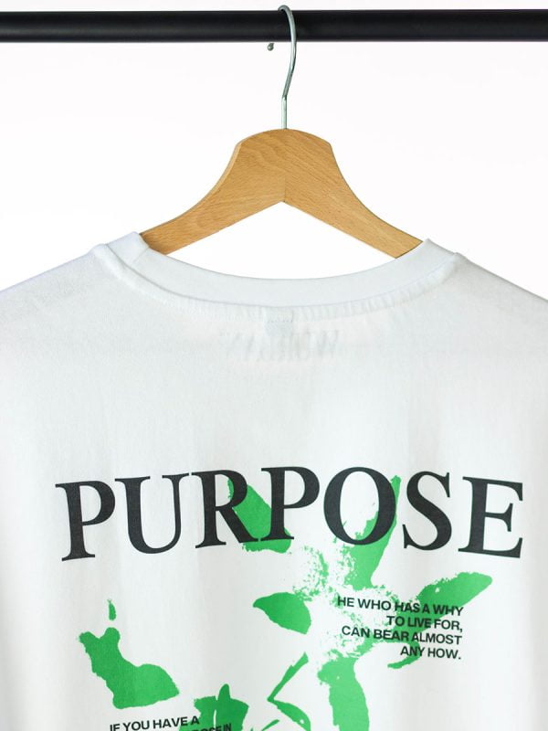 Oversized shirt van Wurban Wear met de tekst purpose of terwijl doel op de achterkant